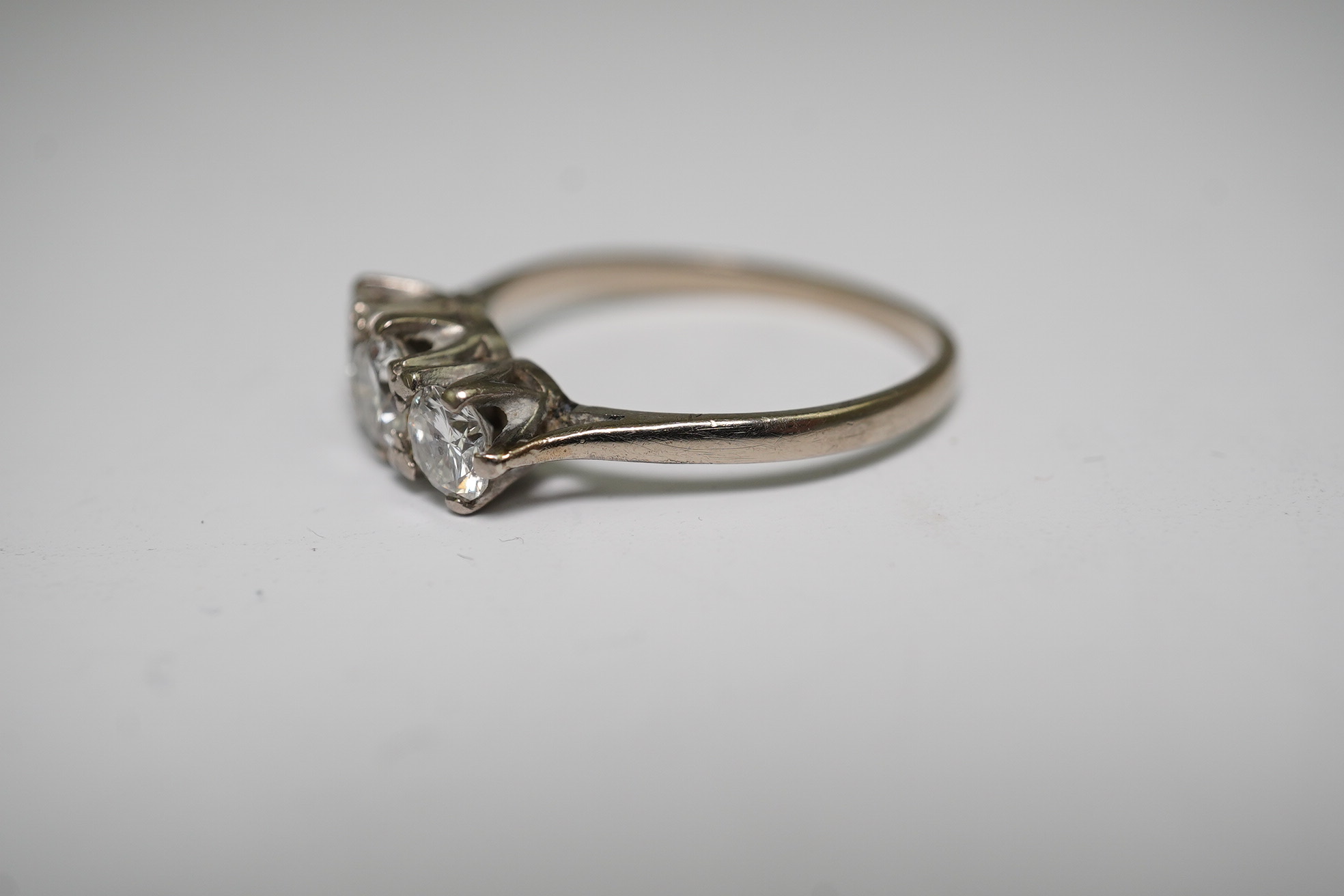 An 18ct white gold and three stone diamond set ring